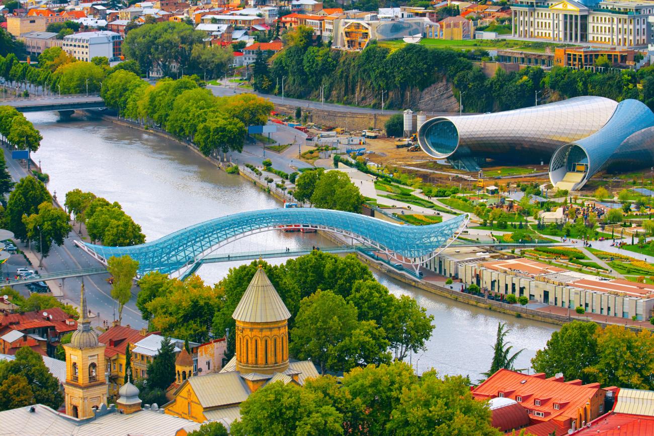 Tbilisi Peace Bridge with view of the river and surrounding buildings